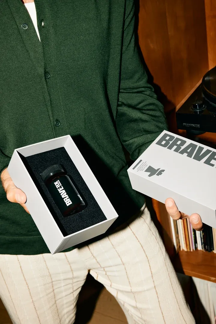 A man holding a BraveRX treatment box and its packaging