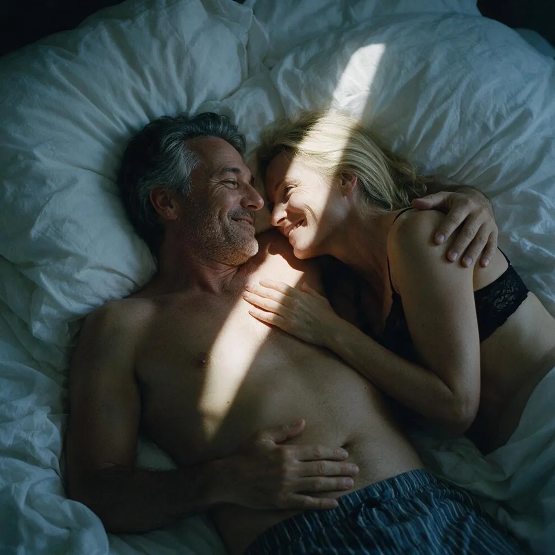 A couple holding each other in bed